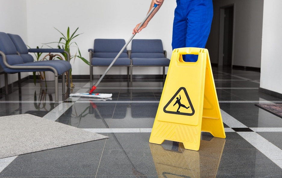 A man doing cleaning in an office